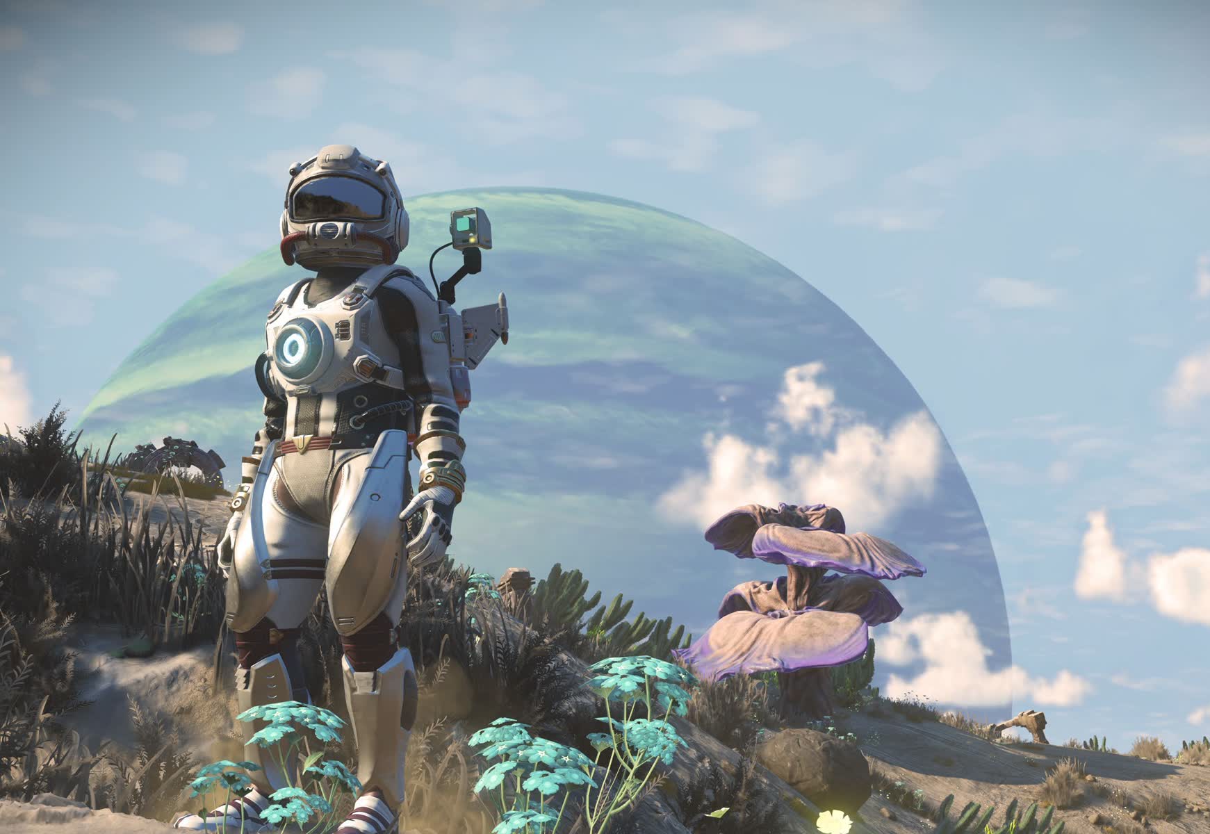 A No Man's Sky traveller standing among alien plants beneath a large planet